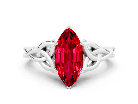 White gold Marquise Cut Ruby Solitaire Engagement Ring with Celtic Knot Band and Four-Prong Setting
