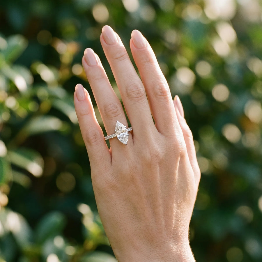 White gold Marquise Cut Solitaire Diamond Engagement Ring with Pave Band and Four-Prong Setting