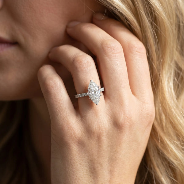 White gold Marquise Cut Solitaire Diamond Engagement Ring with Pave Band and Four-Prong Setting