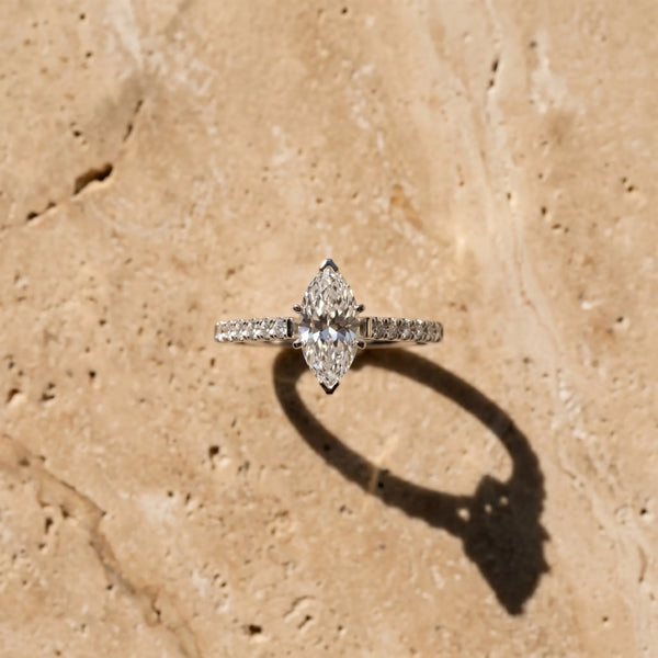 White gold Marquise Cut Solitaire Diamond Ring with Pave Band and Four-Prong Setting