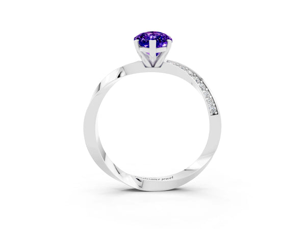 Silver Marquise Cut Tanzanite Engagement Ring with Side Stone Accents and Four-Prong Setting