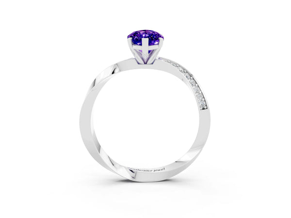 White gold Marquise Cut Tanzanite Engagement Ring with Side Stone Accents and Four-Prong Setting