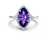 White gold Marquise Cut Tanzanite Halo Ring with Tapered Band and Four-Prong Setting