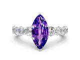 White gold Marquise Cut Tanzanite Prong Setting with Side Stones on a Pave Band