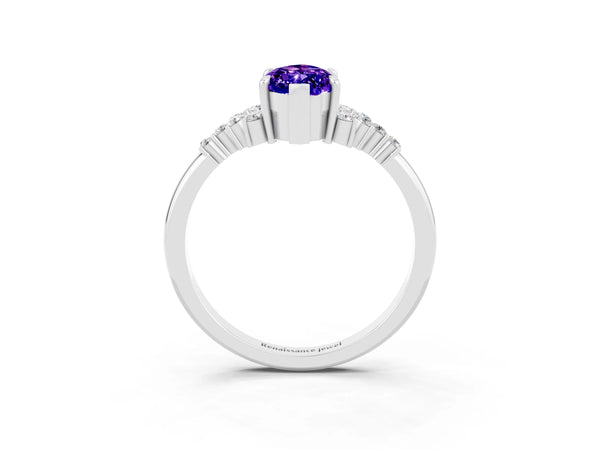 Silver Marquise Cut Tanzanite Ring with Side Stones and Four-Prong Setting