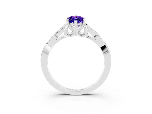 White gold Marquise Cut Tanzanite Solitaire Celtic Knot Ring with Four-Prong Setting