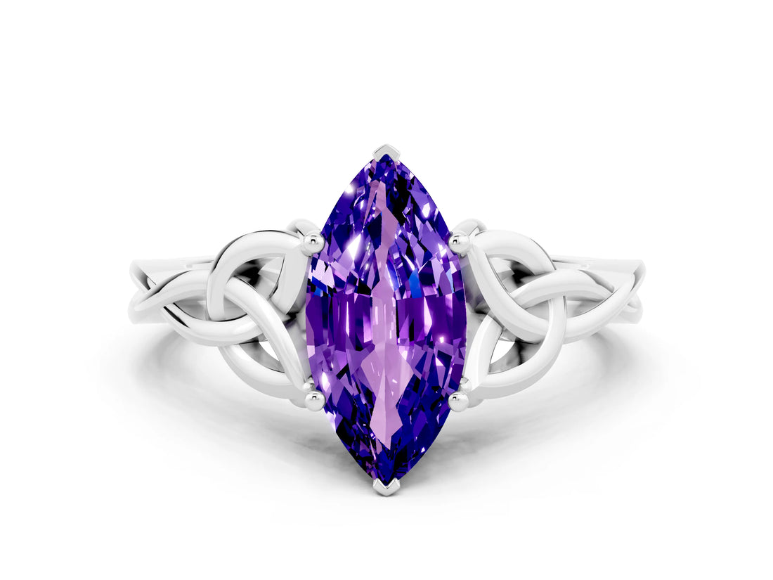 White gold Marquise Cut Tanzanite Solitaire Engagement Ring with Celtic Knot Band and Four-Prong Setting