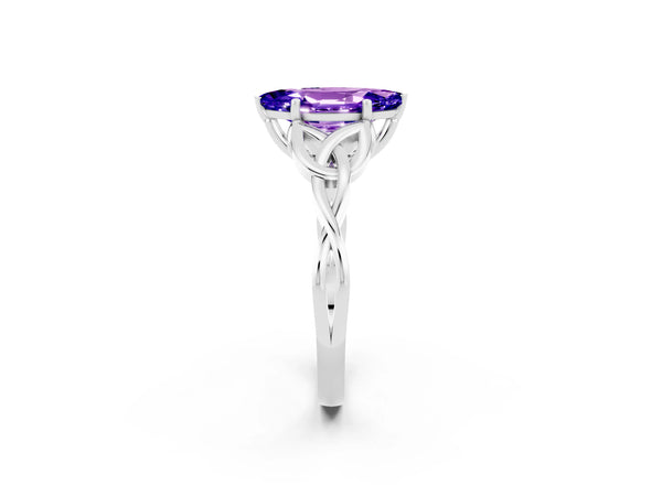 White gold Marquise Cut Tanzanite Solitaire Engagement Ring with Celtic Knot Band and Four-Prong Setting