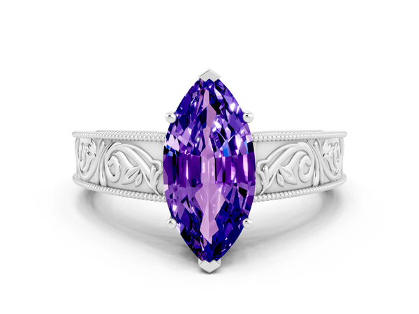 Platinum Marquise Cut Tanzanite Solitaire Ring with Engraved Band and Four-Prong Setting