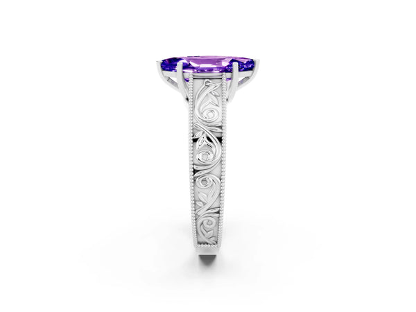 Platinum Marquise Cut Tanzanite Solitaire Ring with Engraved Band and Four-Prong Setting