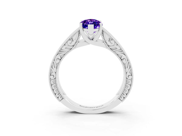 White gold Marquise Cut Tanzanite Solitaire Ring with Engraved Band and Four-Prong Setting
