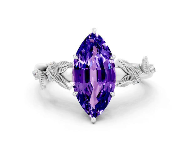 White gold Marquise Cut Tanzanite Solitaire Ring with Leaf Motif Band and Four-Prong Setting