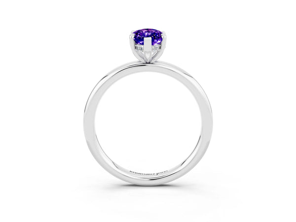 White gold Marquise Cut Tanzanite Solitaire Ring with Thin Band and Four-Prong Setting