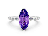 White gold Marquise Cut Tanzanite Solitaire with Side Stones on a Pavé Band and Four-Prong Setting