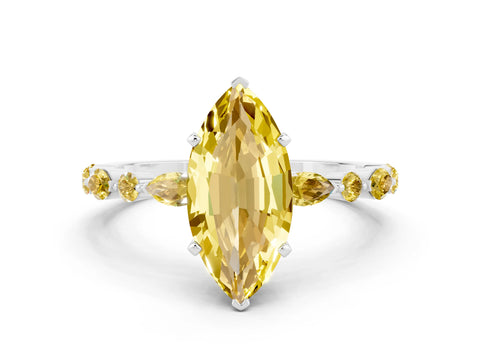 White gold Marquise Cut Yellow Sapphire Solitaire with Side Stones on a Pavé Band and Four-Prong Setting