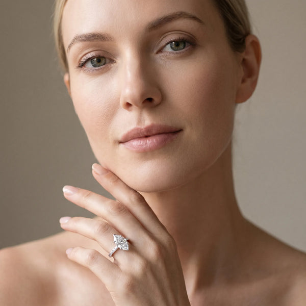 White gold Marquise Diamond Solitaire Ring with Bezel Setting and Classic Band