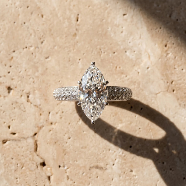 White gold Marquise Diamond Solitaire Ring with Prong Setting and Pavé Band
