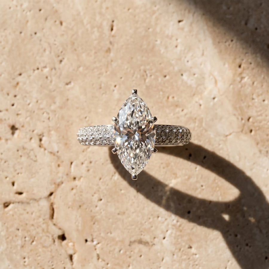 White gold Marquise Diamond Solitaire Ring with Prong Setting and Pavé Band