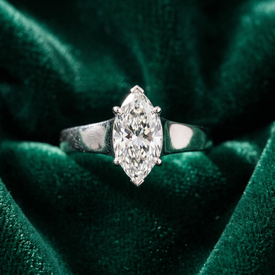 White gold Marquise Diamond Solitaire Ring with Tapered Band and Prong Setting
