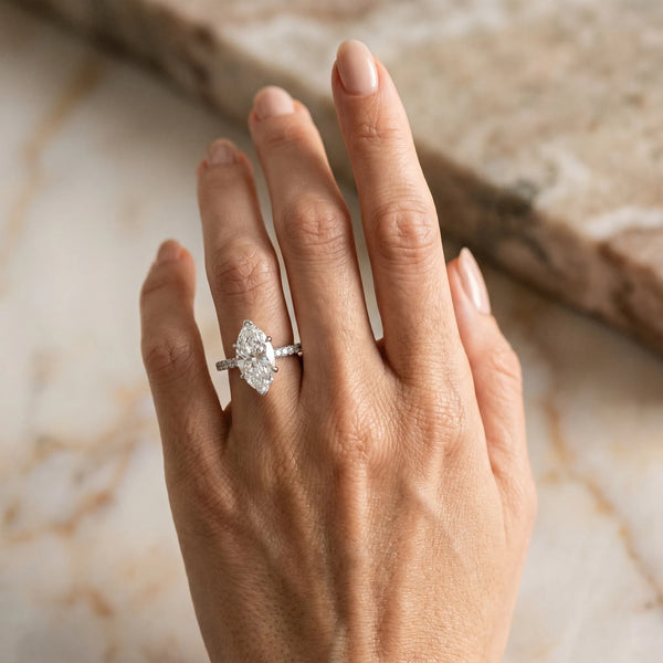 White gold Marquise Solitaire Diamond Engagement Ring with Pave Band and Six-Prong Setting