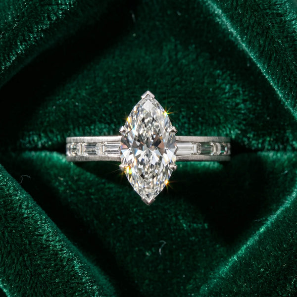 White gold Marquise Solitaire Diamond Ring with Channel-Set Baguette Band and Four-Prong Setting
