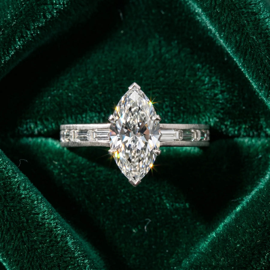 White gold Marquise Solitaire Diamond Ring with Channel-Set Baguette Band and Four-Prong Setting