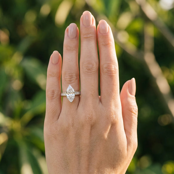 White gold Marquise Solitaire Diamond Ring with Channel-Set Band and Four-Prong Setting
