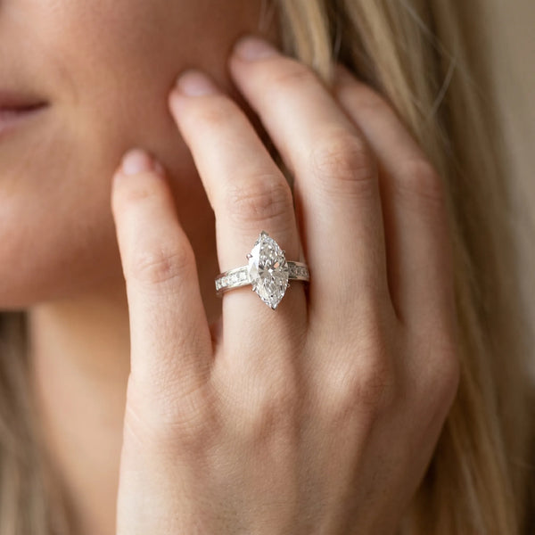 White gold Marquise Solitaire Diamond Ring with Channel-Set Band and Four-Prong Setting