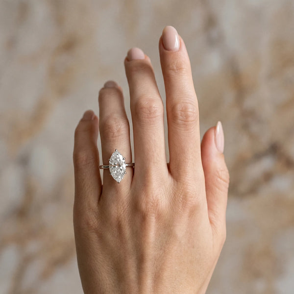 White gold Marquise Solitaire Engagement Ring with Cathedral Band and Four-Prong Setting