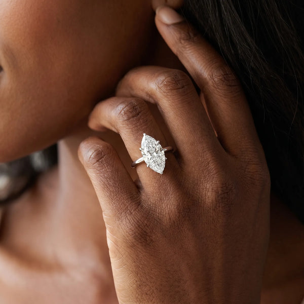 White gold Marquise Solitaire Engagement Ring with Cathedral Band and Four-Prong Setting