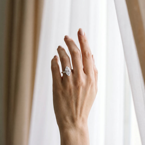 White gold Marquise Solitaire Engagement Ring with Four-Prong Setting and Tapered Band