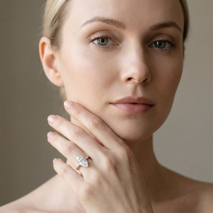 White gold Marquise Solitaire Engagement Ring with Four-Prong Setting and Tapered Band