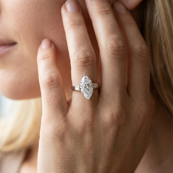 White gold Marquise Solitaire Engagement Ring with Four-Prong Setting and Tapered Band