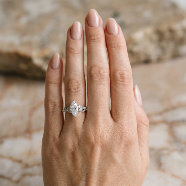 White gold Marquise Solitaire Leaf-Inspired Diamond Ring with Pavé Band and Four-Prong Setting