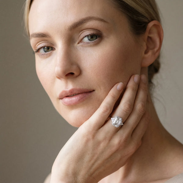White gold Milgrain Emerald Cut Diamond Ring with Tapered Pave Band and Four Prong Setting