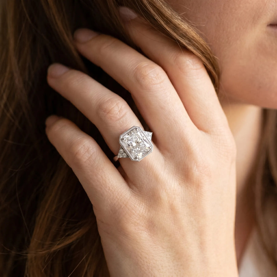 White gold Milgrain Radiant Cut Diamond Ring with Tapered Pave Band and Four Prong Setting