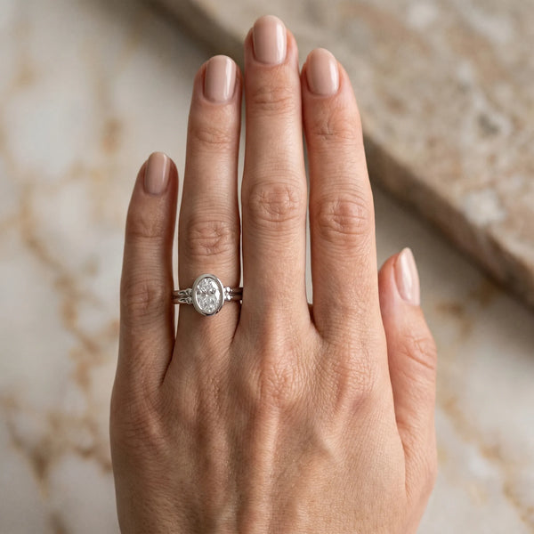 White gold Oval Bezel Solitaire Ring with Split Shank Band
