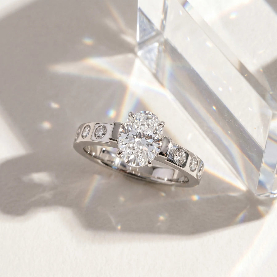White gold Oval Brilliant Channel-Set Diamond Ring with Bezel Prong Setting