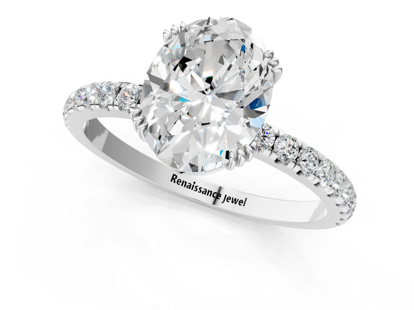 White gold Oval Brilliant Solitaire with Pavé Band and Claw Prong Setting