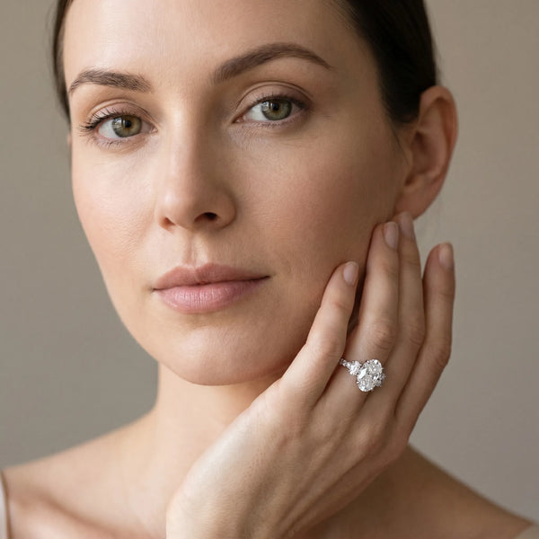 White gold Oval Brilliant Trilogy Channel Set Diamond Ring with Bar Prongs