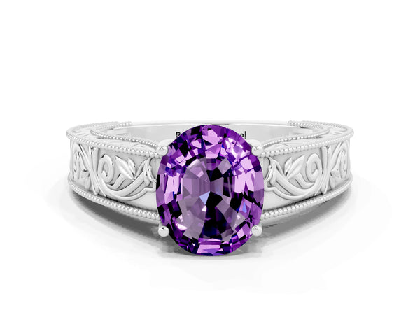 White gold Oval Cut Amethyst Solitaire Ring with Engraved Band and Four-Prong Setting