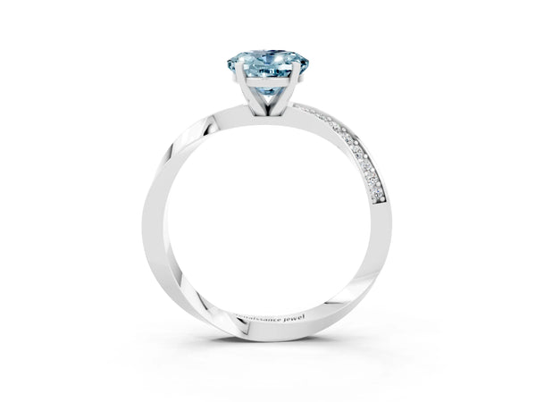 Silver Oval Cut Aquamarine Engagement Ring with Side Stone Accents and Four-Prong Setting