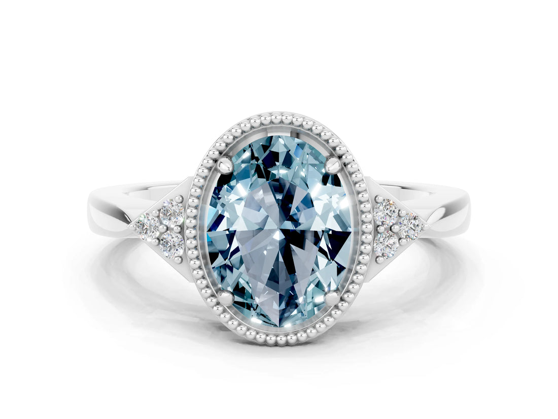 White gold Oval Cut Aquamarine Halo Ring with Tapered Band and Four-Prong Setting