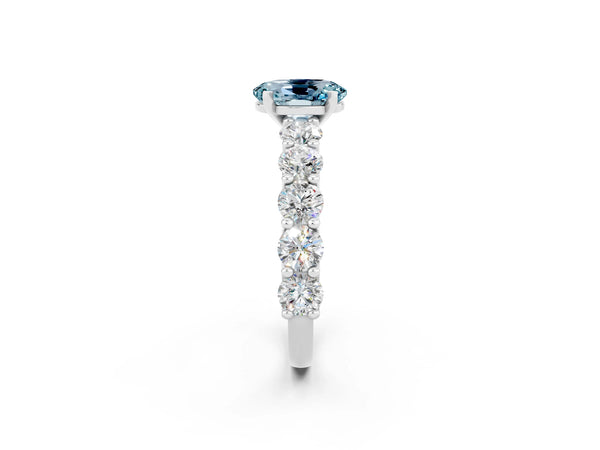 Silver Oval Cut Aquamarine Prong Setting with Side Stones on a Pave Band