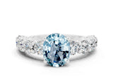 White gold Oval Cut Aquamarine Prong Setting with Side Stones on a Pave Band
