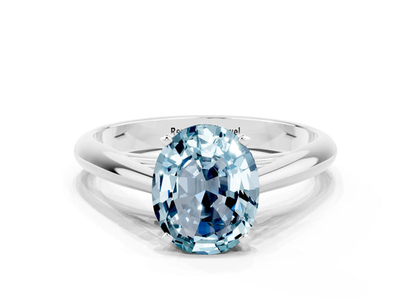 Platinum Oval Cut Aquamarine Solitaire Engagement Ring with Cathedral Setting and Four-Prong Mount