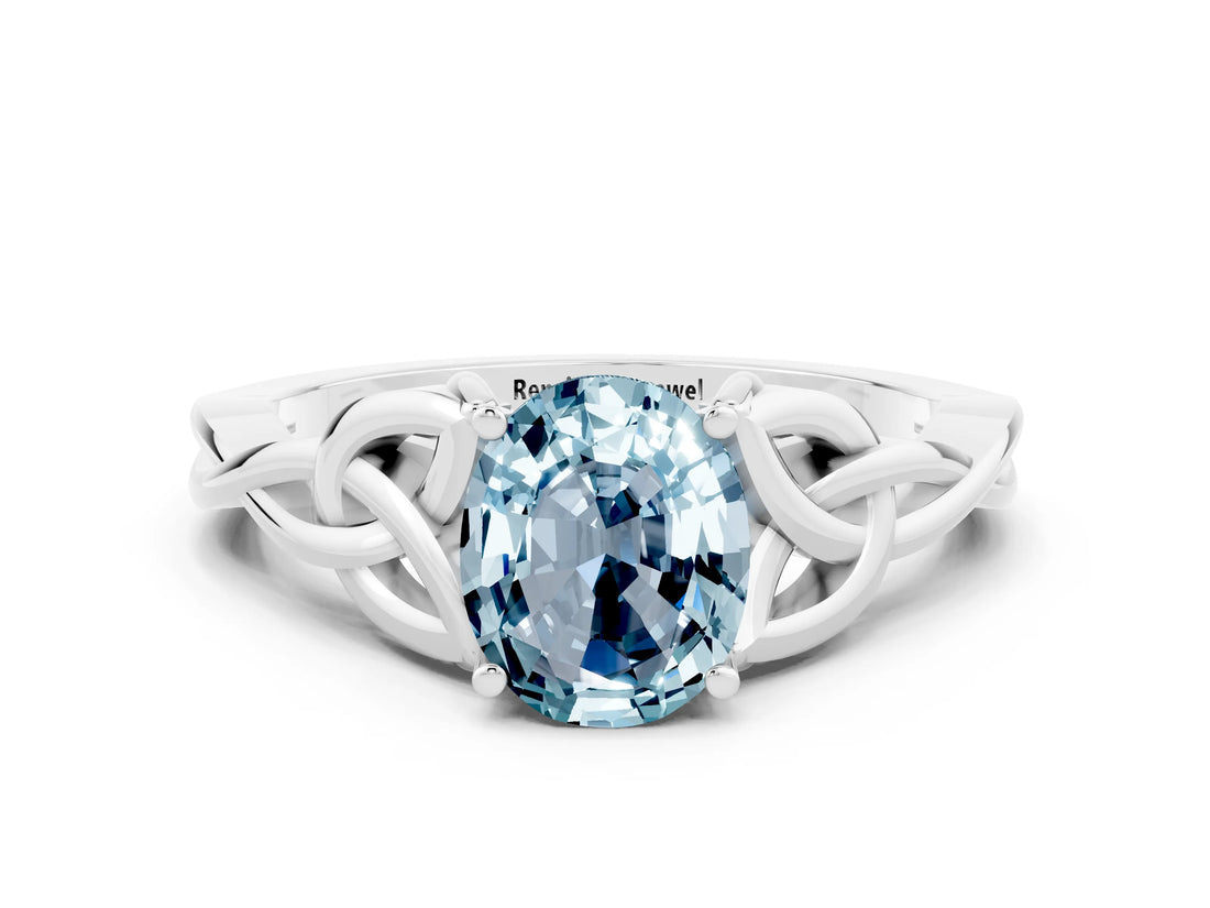 White gold Oval Cut Aquamarine Solitaire Engagement Ring with Celtic Knot Band and Four-Prong Setting