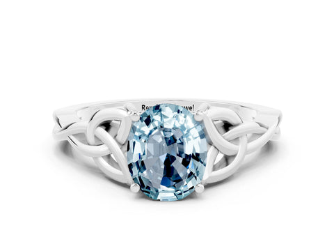 White gold Oval Cut Aquamarine Solitaire Engagement Ring with Celtic Knot Band and Four-Prong Setting