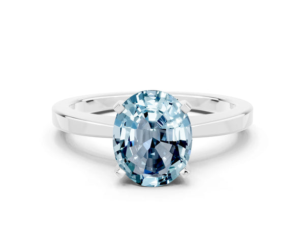 Platinum Oval Cut Aquamarine Solitaire Engagement Ring with Classic Band and Four-Prong Setting