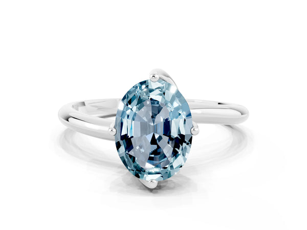 Silver Oval Cut Aquamarine Solitaire Engagement Ring with Four-Prong Setting and Classic Band